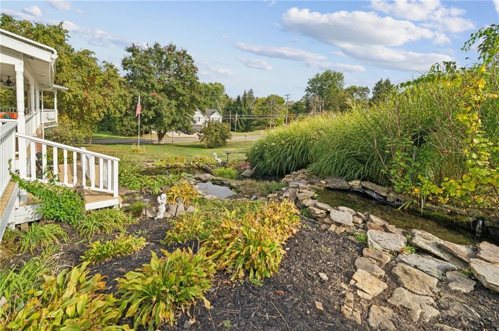 1200 Hahntown-Wendel Road Irwin, PA 15642 - Photo 45 of 49 a view of a garden with plants and large trees