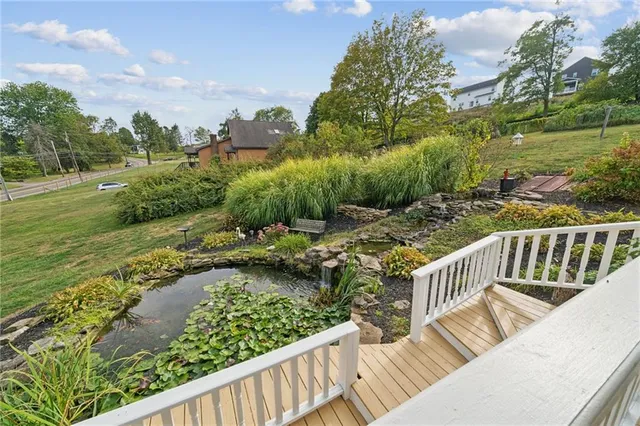a view of a balcony with wooden floor