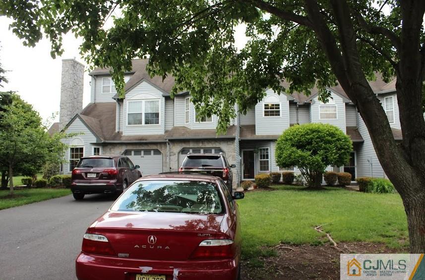 384 Draco Road Piscataway, NJ 08854 - Photo 1 of 19 a car parked in front of a house with a yard