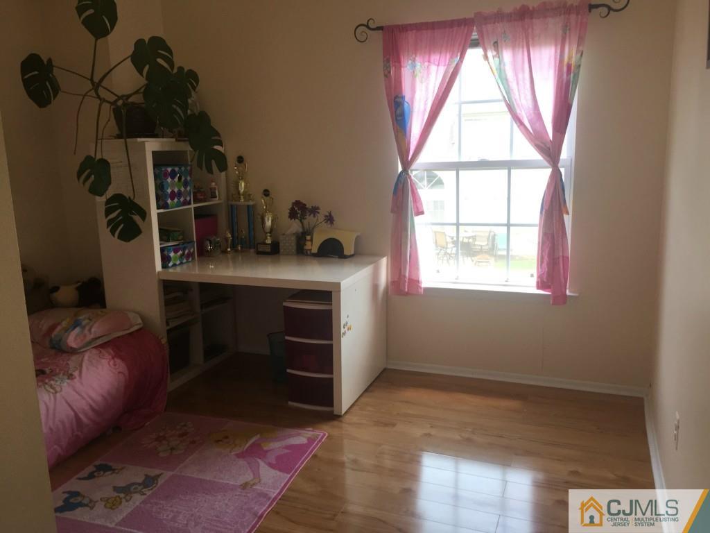 384 Draco Road Piscataway, NJ 08854 - Photo 13 of 19 a room with a bed and a window
