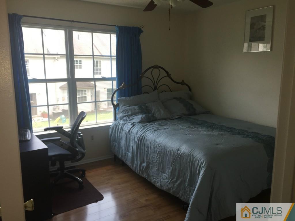 384 Draco Road Piscataway, NJ 08854 - Photo 14 of 19 a bed sitting in a bedroom next to a window