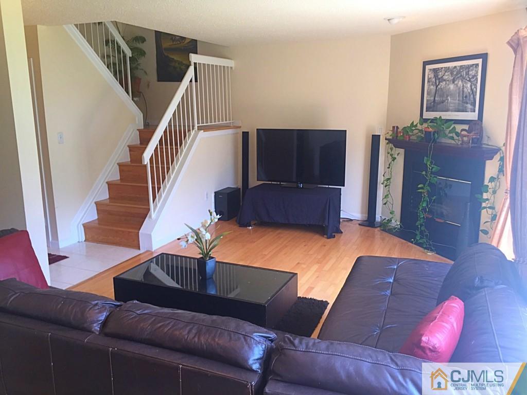 384 Draco Road Piscataway, NJ 08854 - Photo 5 of 19 a living room with furniture and a flat screen tv