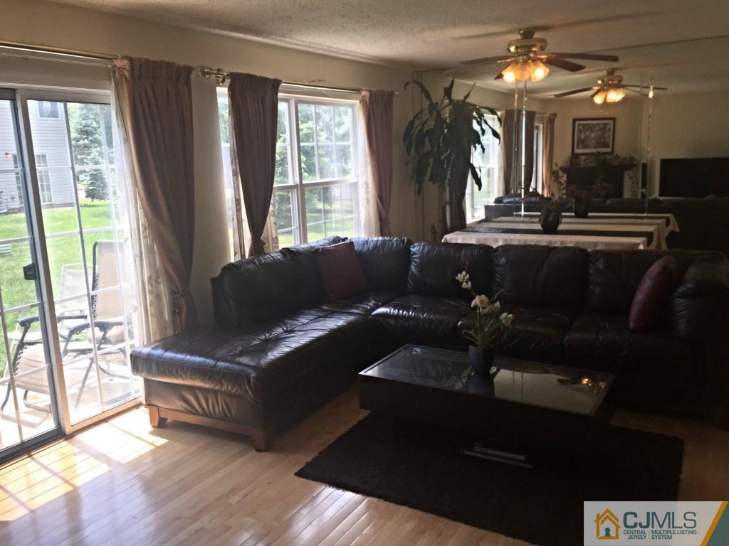 384 Draco Road Piscataway, NJ 08854 - Photo 6 of 19 a living room with furniture and a large window