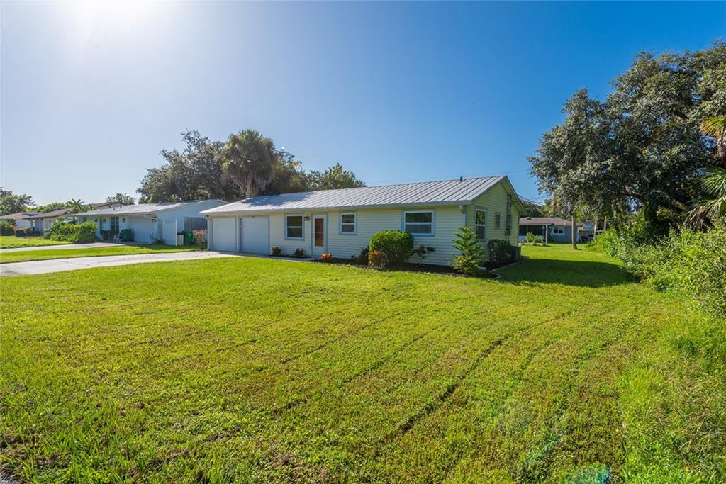 21053 Riddle Avenue Port Charlotte, FL 33954 - Photo 1 of 1 Front angle view of home