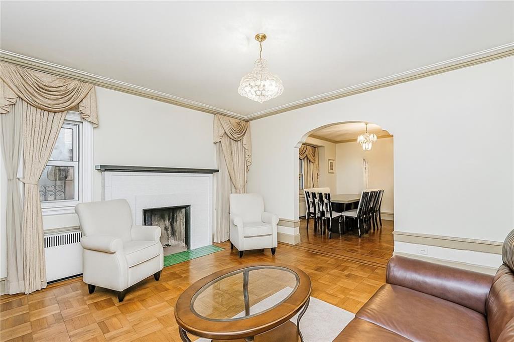 1917 Glenwood Road Brooklyn, NY 11230 - Photo 12 of 36 a living room with furniture and a fireplace