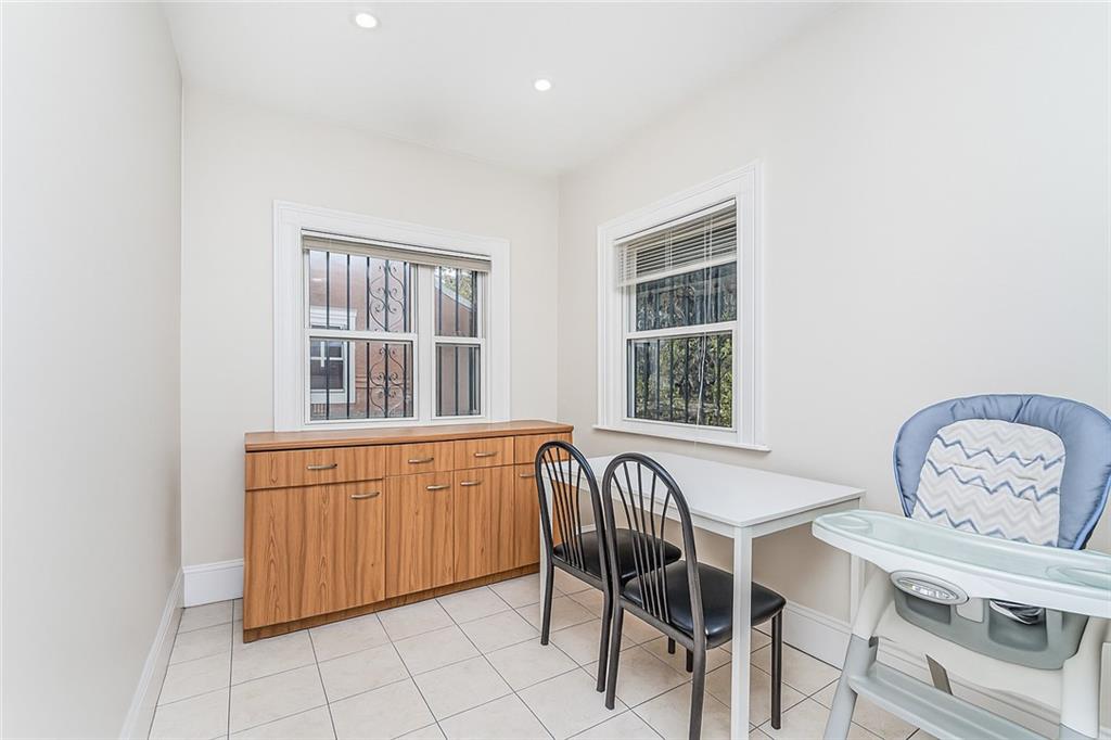 1917 Glenwood Road Brooklyn, NY 11230 - Photo 20 of 36 a view of a dining room with furniture and window