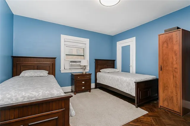 a bedroom with a bed and a dresser