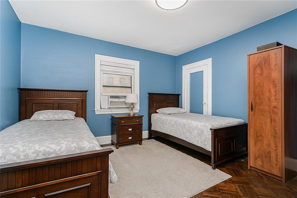 1917 Glenwood Road Brooklyn, NY 11230 - Photo 26 of 36 a bedroom with a bed and a dresser