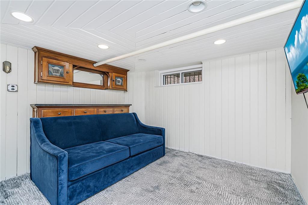 1917 Glenwood Road Brooklyn, NY 11230 - Photo 32 of 36 a living room with furniture and a window