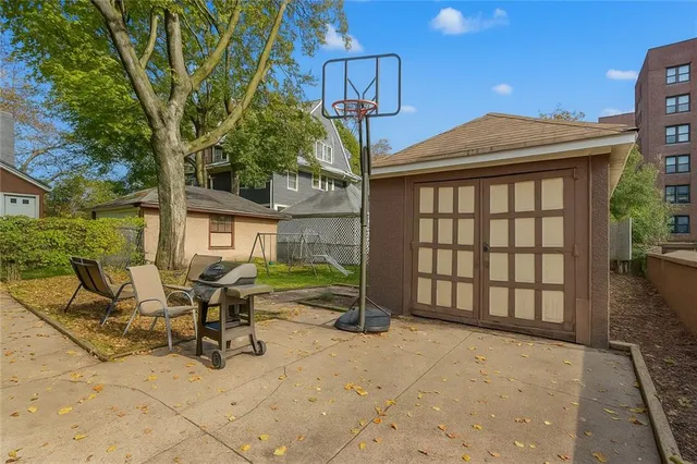 a view of a house with backyard porch and sitting area