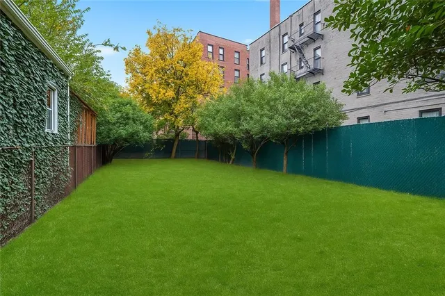 a view of a backyard with a garden