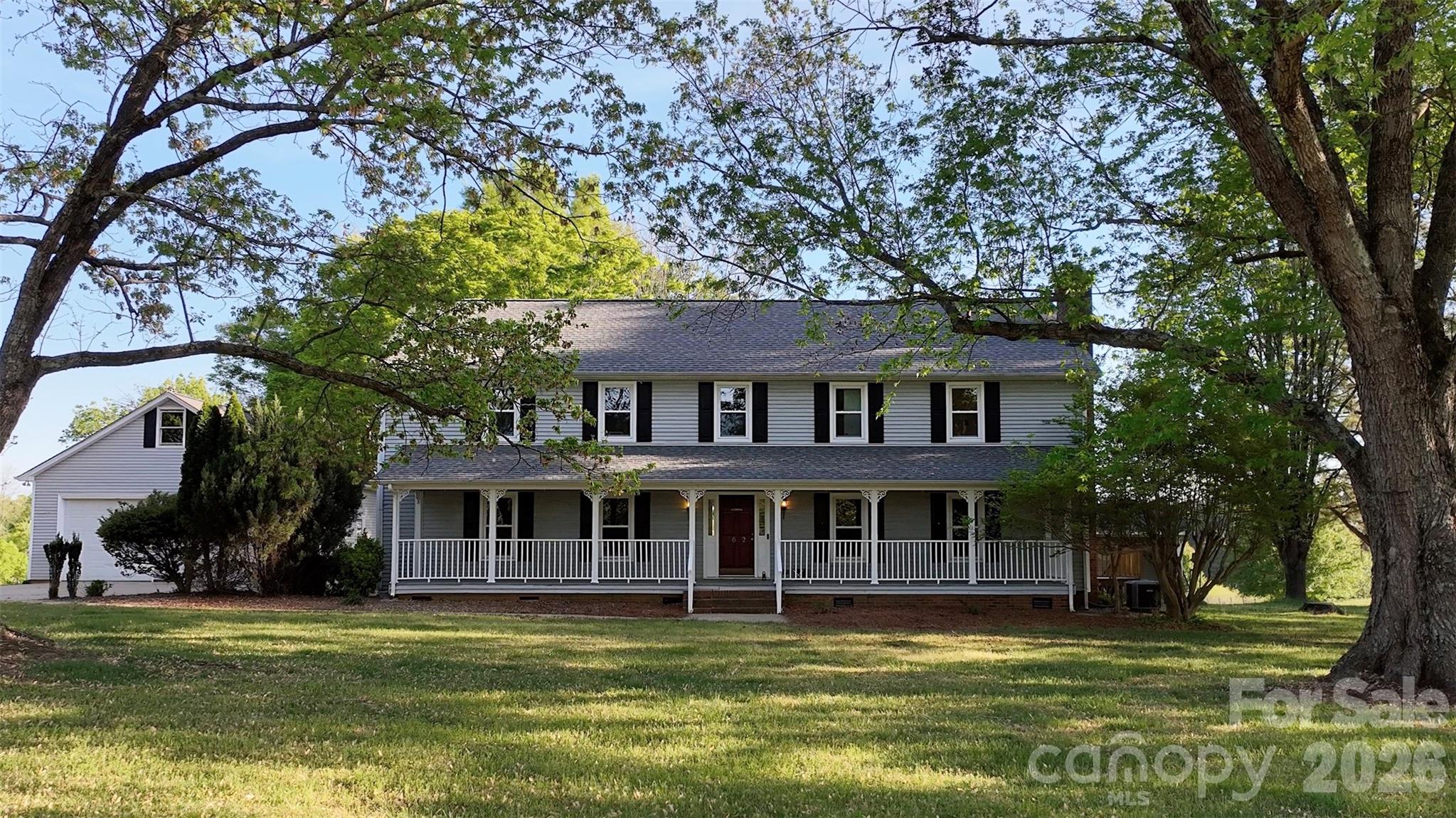 5632 Zion Church Road Concord, NC 28025 - Photo 2 of 39 a front view of a house with a garden