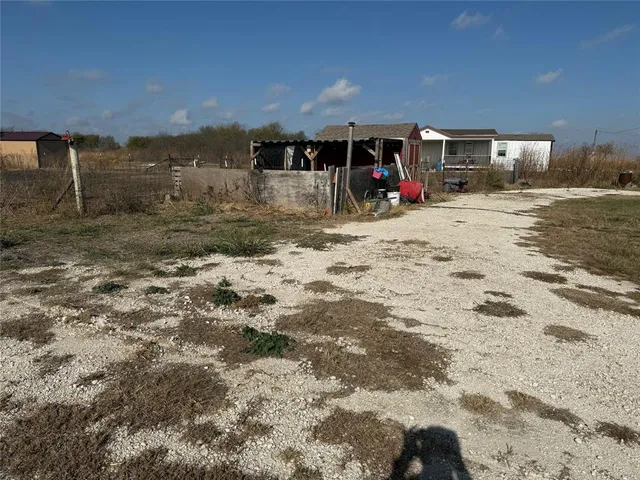 a house view with a backyard space