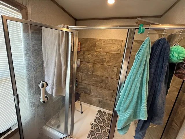 a view of a kitchen area with furniture and wooden floor