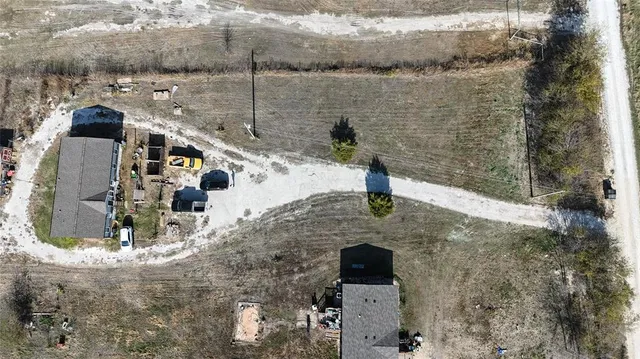 an aerial view of residential house with outdoor space