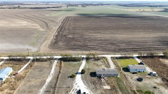 a view of a cars parked in a yard