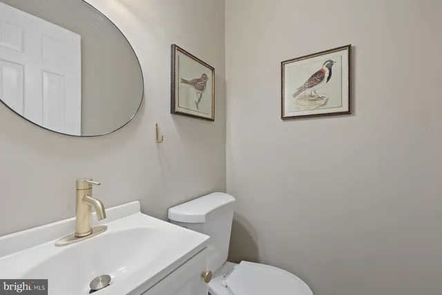 a bathroom with a toilet and a sink