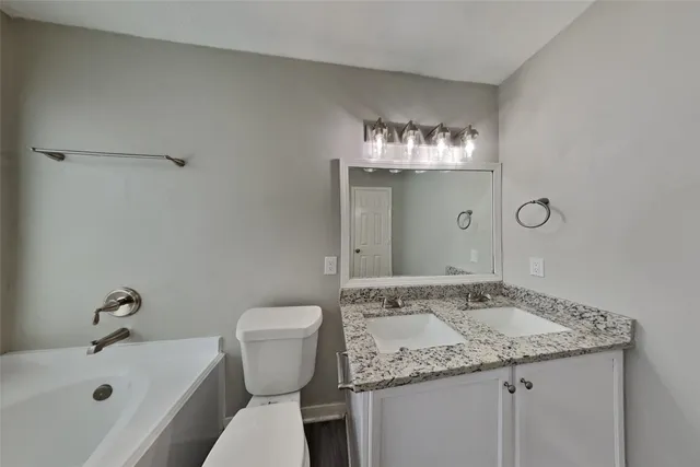 a bathroom with a sink and a toilet