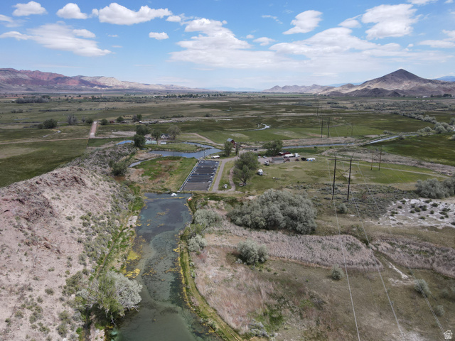 202 North Westhaven Road Richfield, UT 84701 - Photo 10 of 10 Expansive open terrain featuring a natural waterway, a small agricultural development, and distant mountains