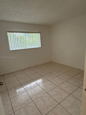 a view of a bathroom with a sink and a mirror