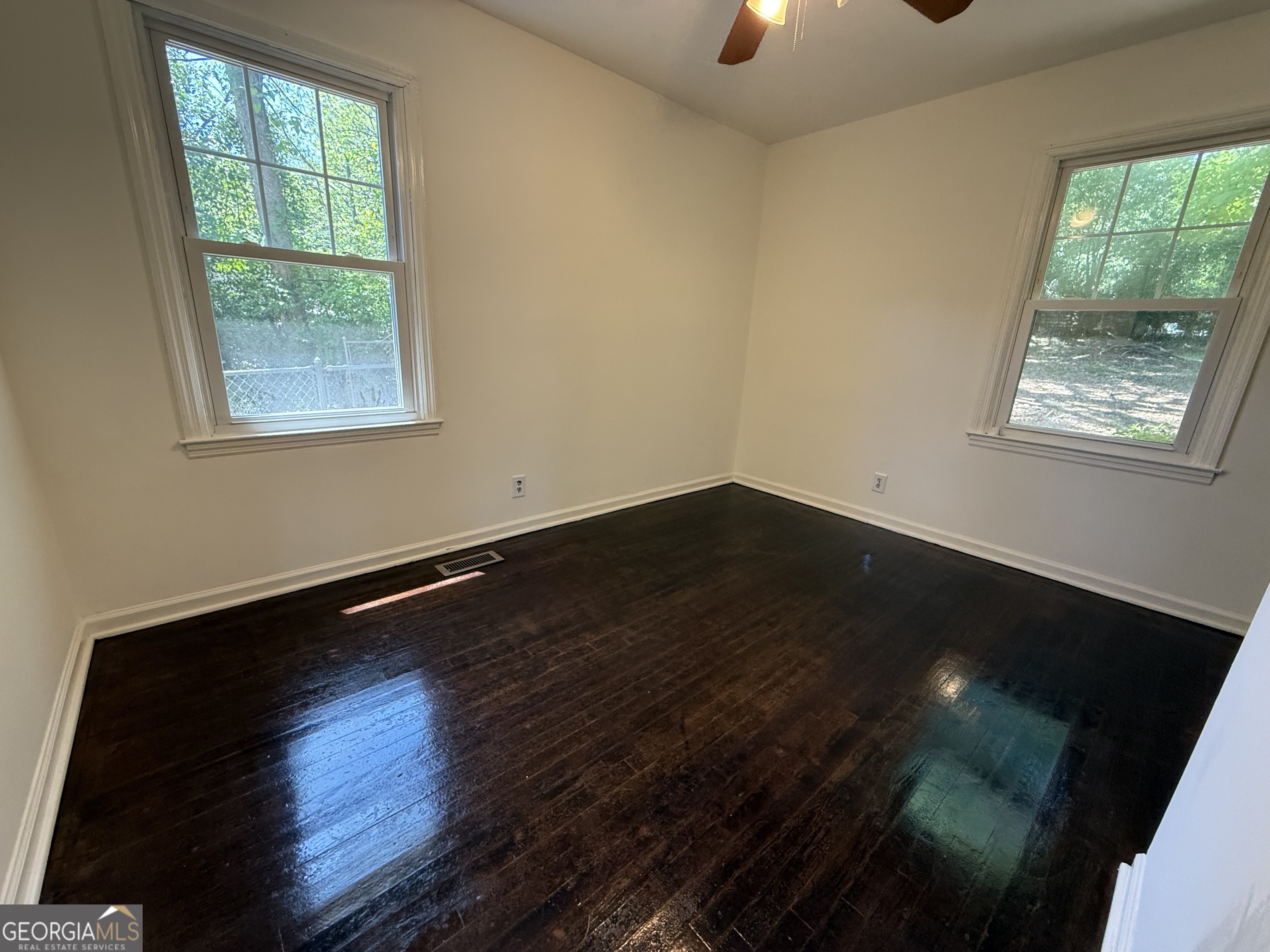 179 Youngs Mill Road LaGrange, GA 30241 - Photo 18 of 30 a view of an empty room with wooden floor and a window