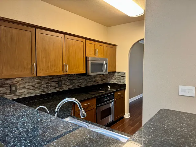 a close view of a sink a washer and dryer