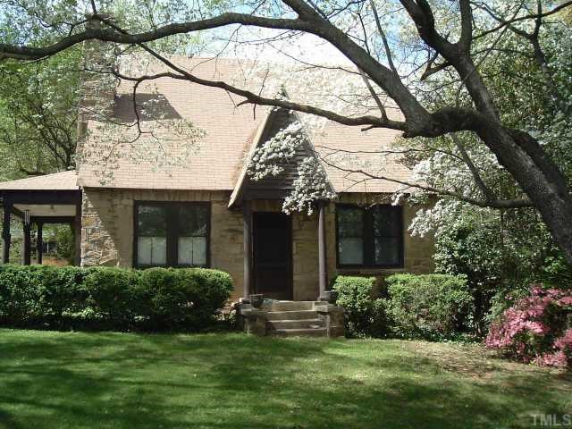 1425 Wake Forest Road Raleigh, NC 27604 - Photo 1 of 1 Charming stone w/ cedar home with covered front porch nestled among hardwood trees.