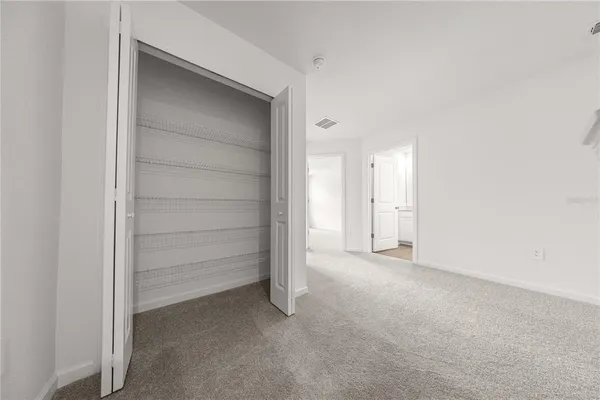 a view of room with walk in closet
