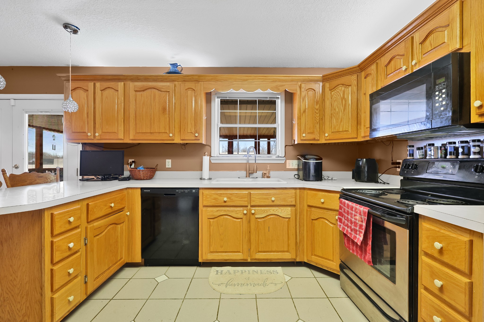 126 4th Avenue North Baxter, TN 38544 - Photo 15 of 33 a kitchen with stainless steel appliances granite countertop a stove sink and cabinets