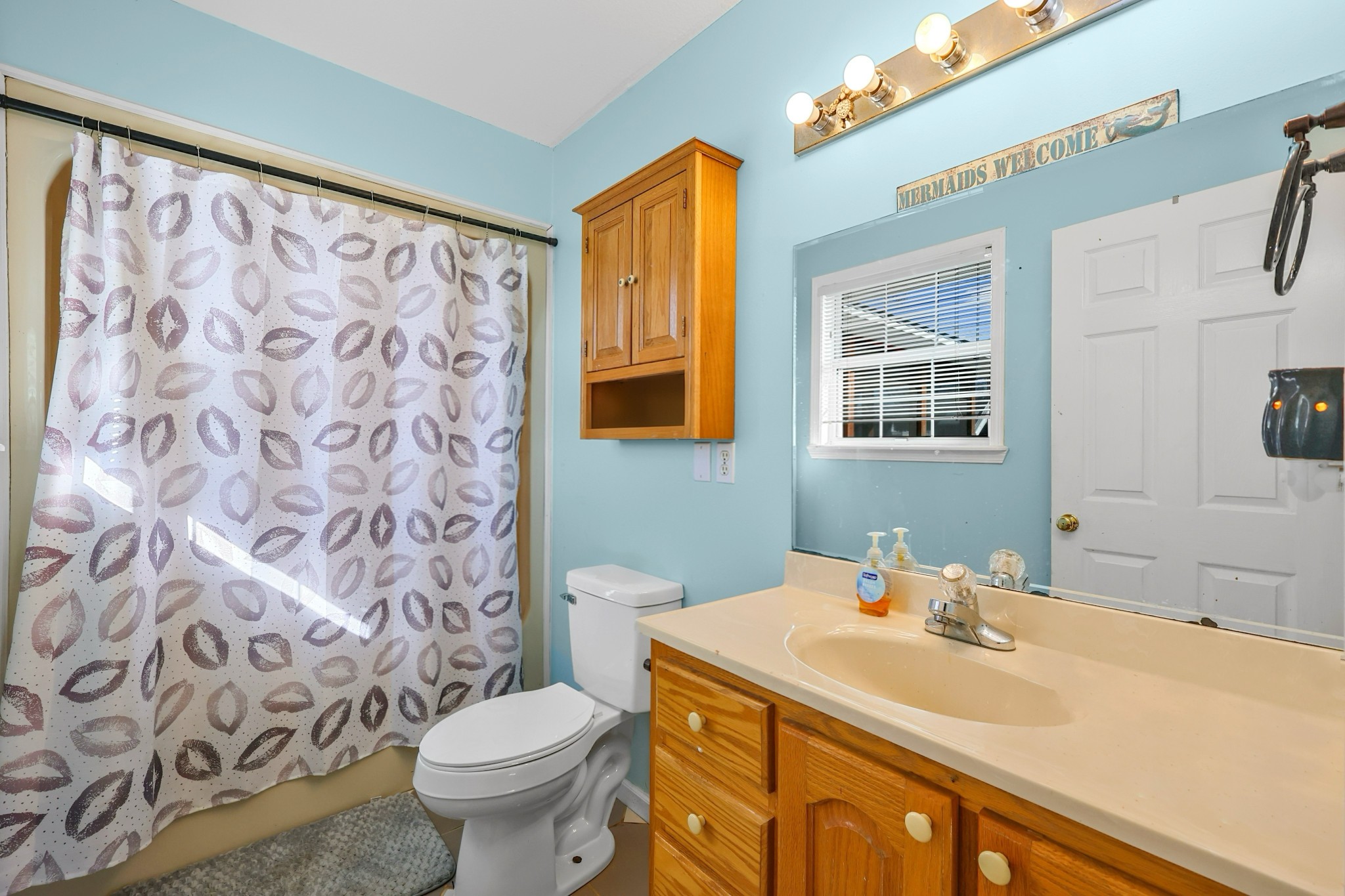 126 4th Avenue North Baxter, TN 38544 - Photo 25 of 33 a bathroom with a sink toilet mirror and shower