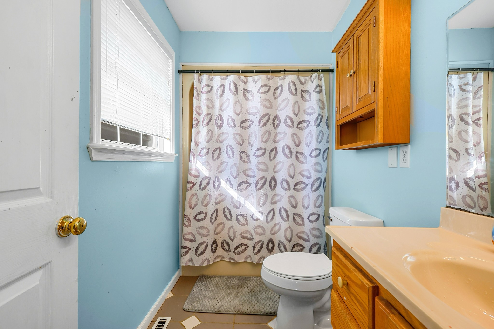 126 4th Avenue North Baxter, TN 38544 - Photo 26 of 33 a bathroom with a sink a toilet and a shower curtain