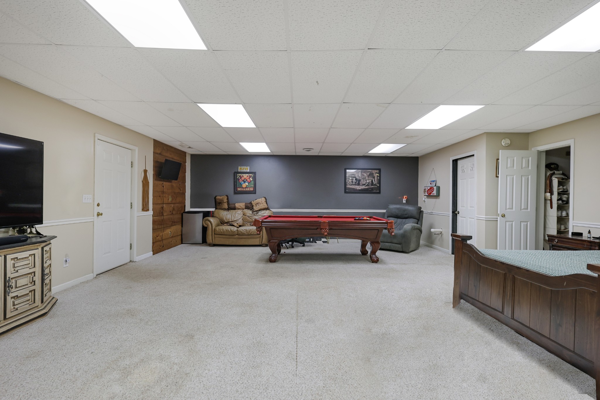 126 4th Avenue North Baxter, TN 38544 - Photo 31 of 33 a bedroom with furniture and a flat screen tv