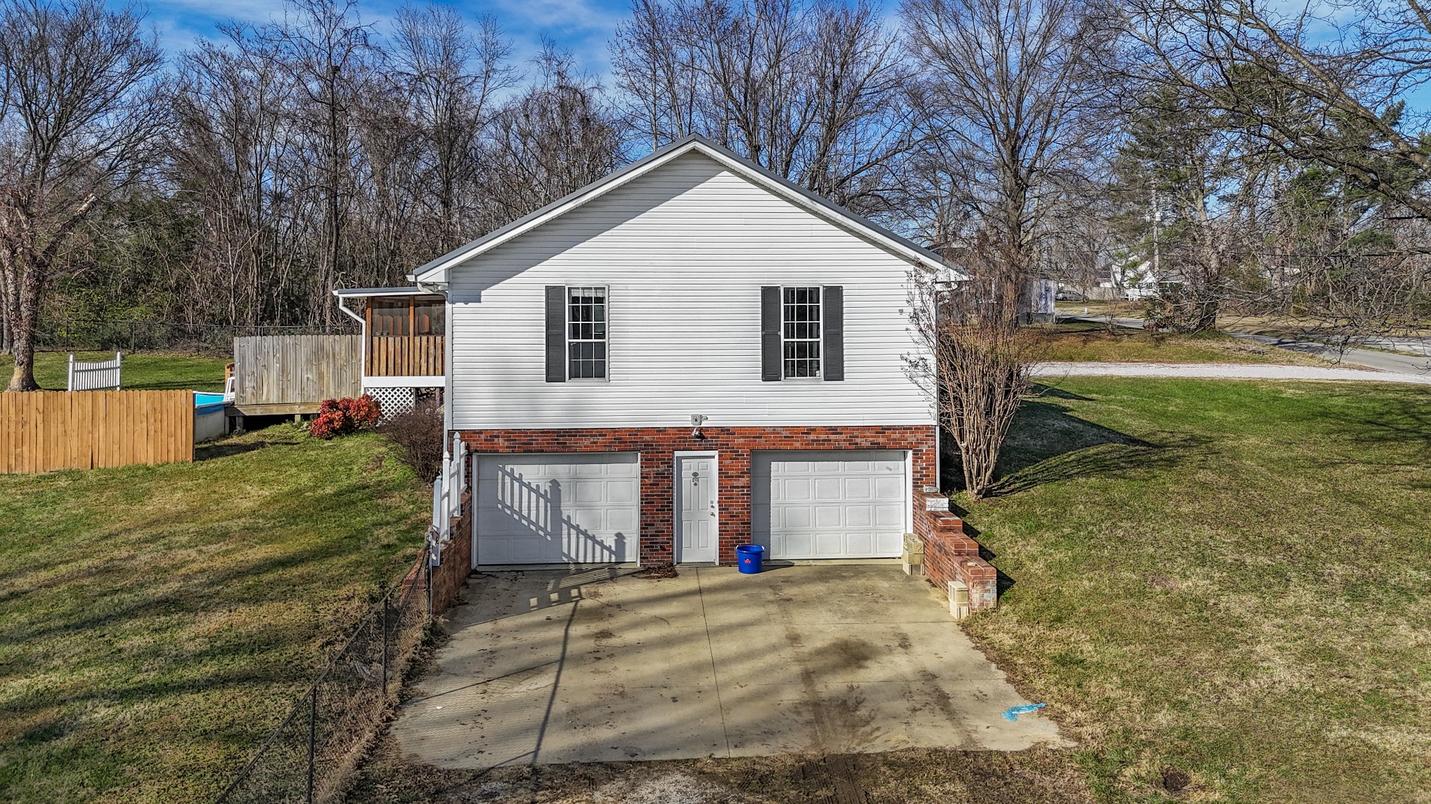 126 4th Avenue North Baxter, TN 38544 - Photo 5 of 33 a view of a white house with a yard and large trees