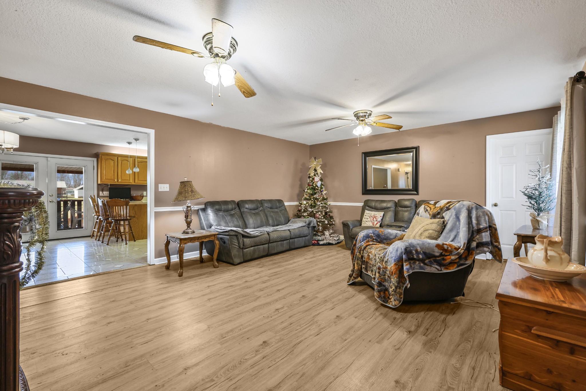 126 4th Avenue North Baxter, TN 38544 - Photo 7 of 33 a living room with furniture a chandelier and a flat screen tv