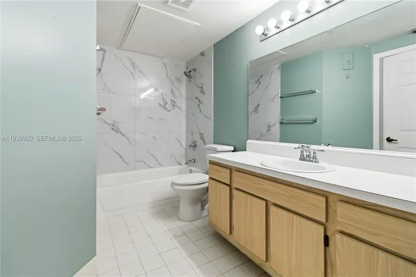 a bathroom with a sink a toilet and a bathtub