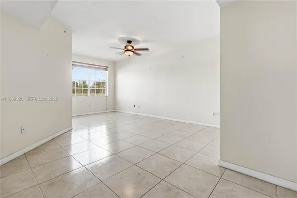 an empty room with a carpet