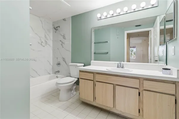 a view of room with stairs and a ceiling fan