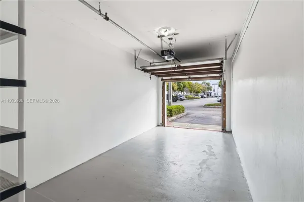 a view of a hallway with a ceiling fan