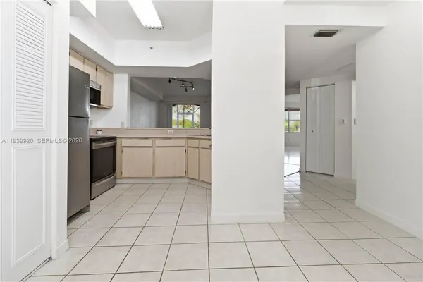 a kitchen with stainless steel appliances a sink and cabinets