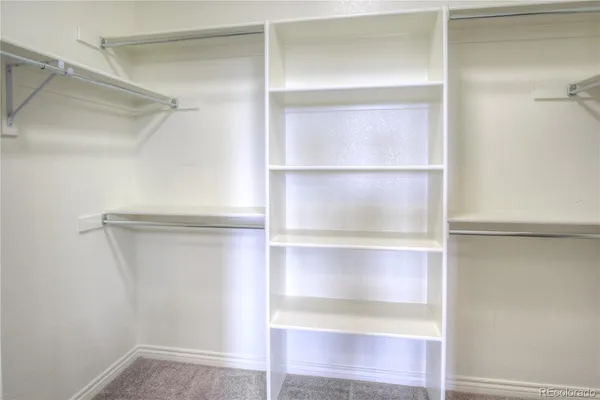 a view of an empty walk in closet