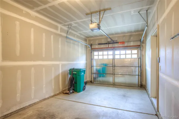 a view of an empty room with glass door