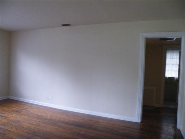 4749 Blackburn Road Jacksonville, FL 32210 - Photo 8 of 26 a view of an empty room and wooden floor