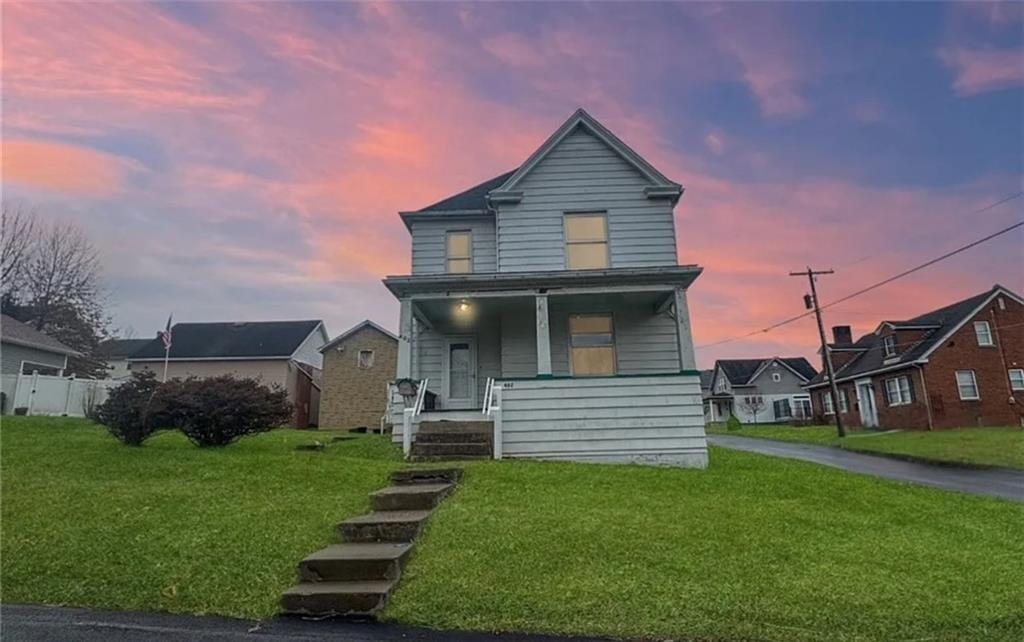 a front view of a house with a yard
