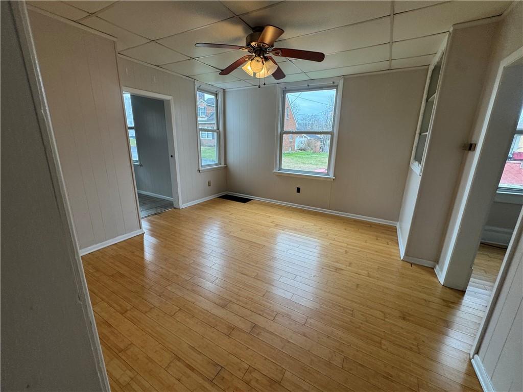 402 Cyrus Street Point Marion, PA 15474 - Photo 15 of 38 a view of an empty room with window and wooden floor