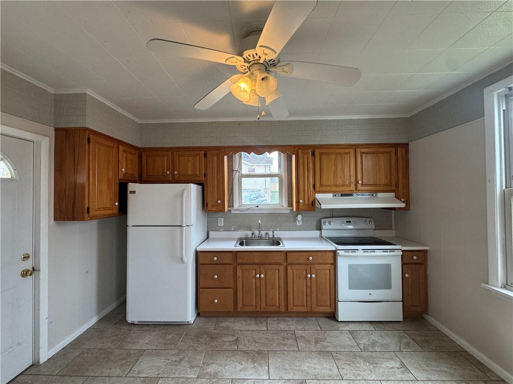 402 Cyrus Street Point Marion, PA 15474 - Photo 16 of 38 a kitchen with a stove a refrigerator and a sink