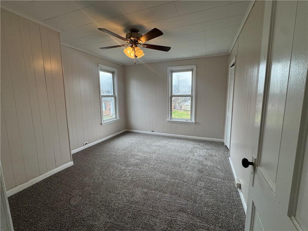 402 Cyrus Street Point Marion, PA 15474 - Photo 28 of 38 an empty room with windows and fan