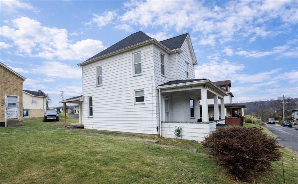 402 Cyrus Street Point Marion, PA 15474 - Photo 4 of 38 a front view of a house with a yard
