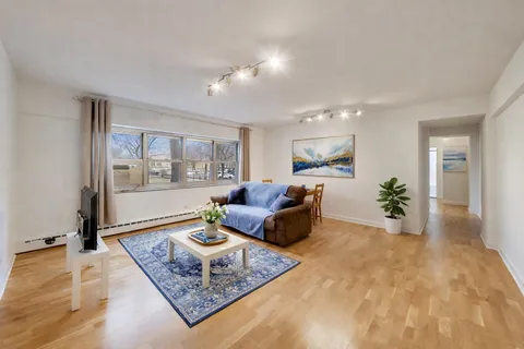 a living room with furniture and a table