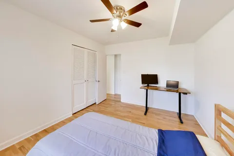 a bedroom with a bed and a table