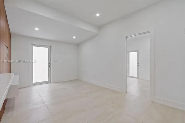 an empty room with an entryway